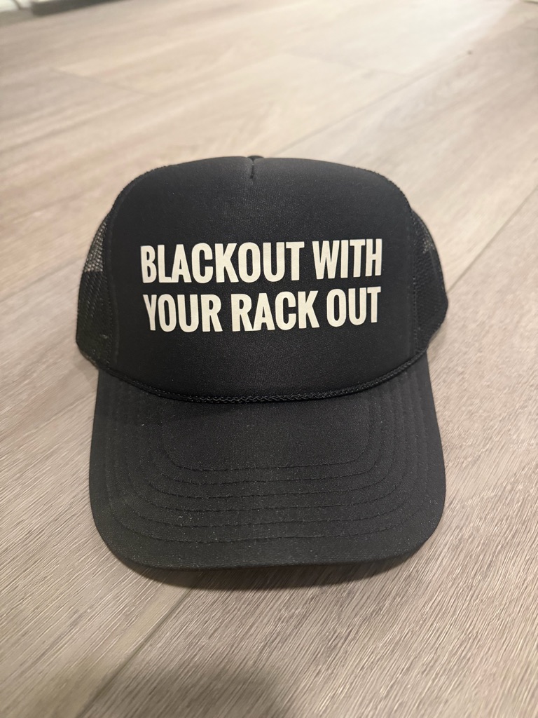 Black Trucker Hat With White Slogan